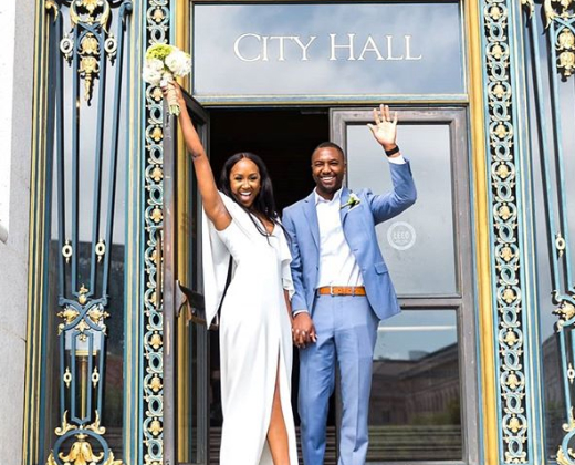 Newly married couple in front of city hall