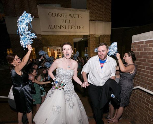 Bride and groom exiting reception venue
