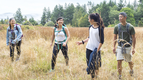 College student walking in a field