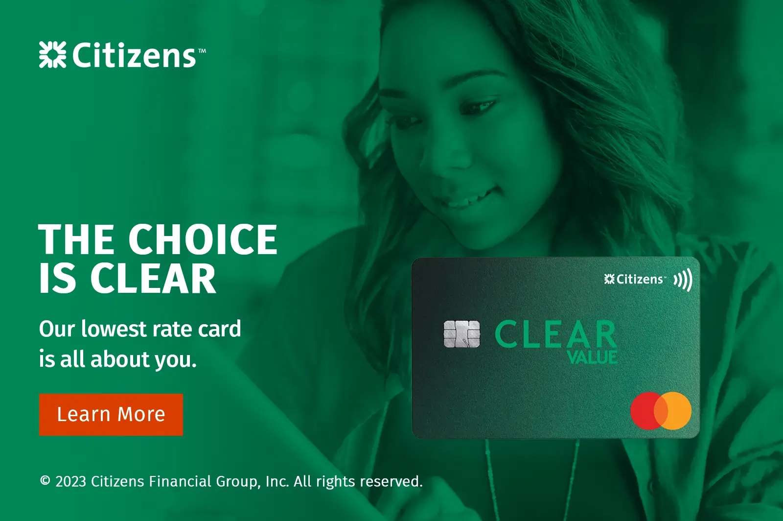 woman looking at computer with a Citizens Clear Value Credit Card image