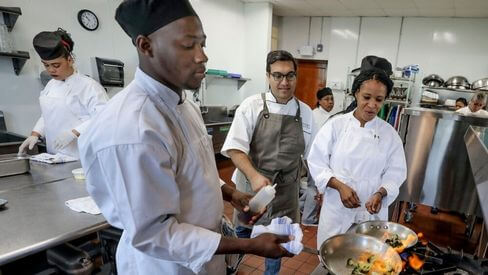 Chefs working in kitchen