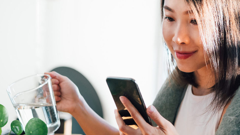 female looking at phone