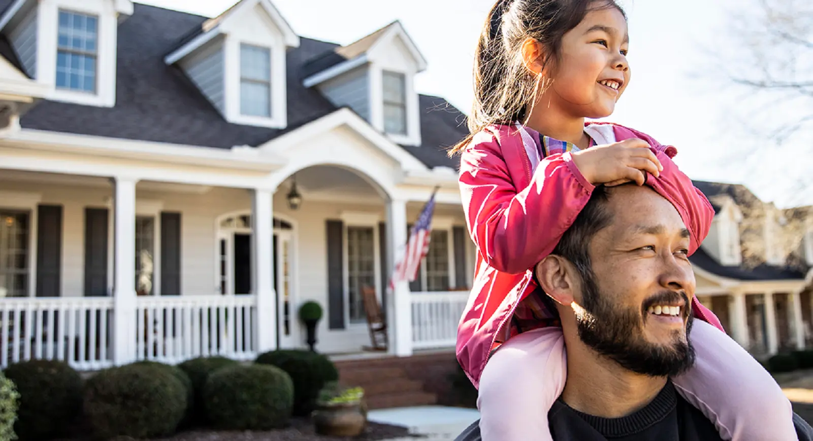 girl on fathers shoulders