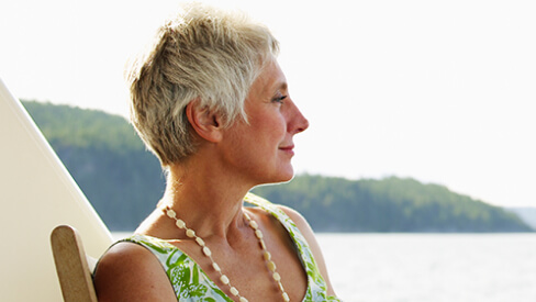 woman looking at lake