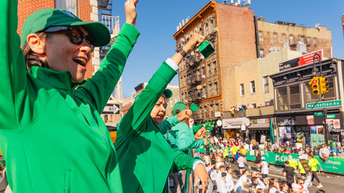 Supporters cheering on runners in the NYC Marathon
