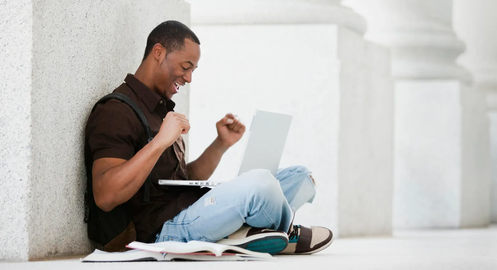 Student excited about applying online for his student loans