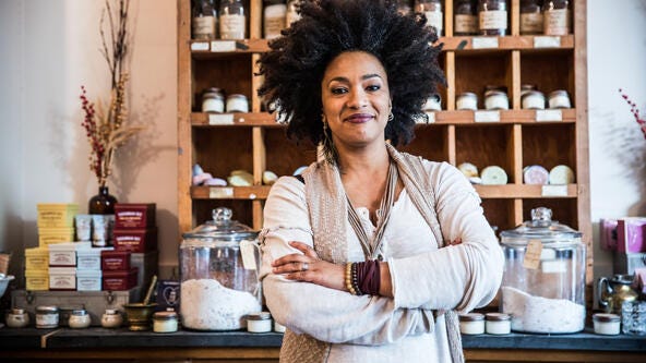 Woman arms folded at her business