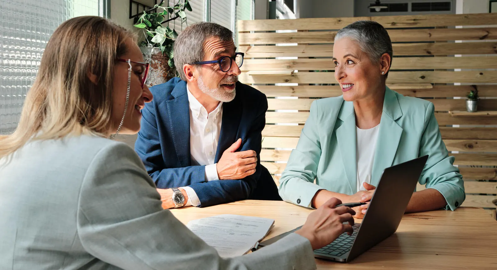 3 people sitting around a table