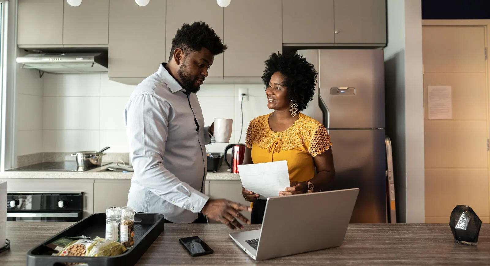 Couple in the kitchen working
