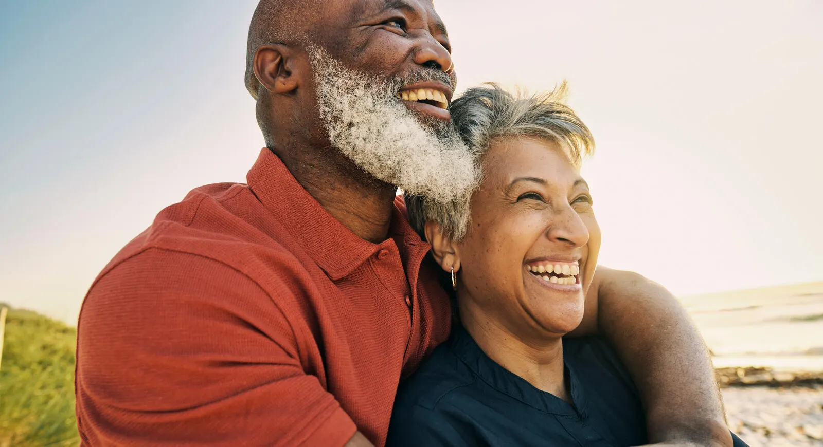 mature-african-american-couple-enjoying-retirement-and-each-others-company-at-the-beach