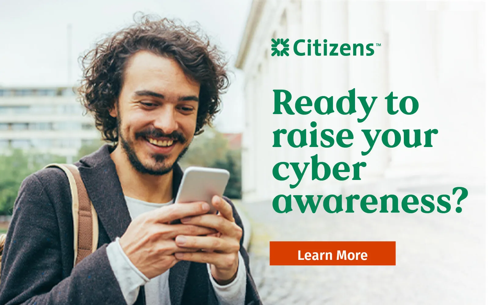 Man looking at phone in image about cyber awareness