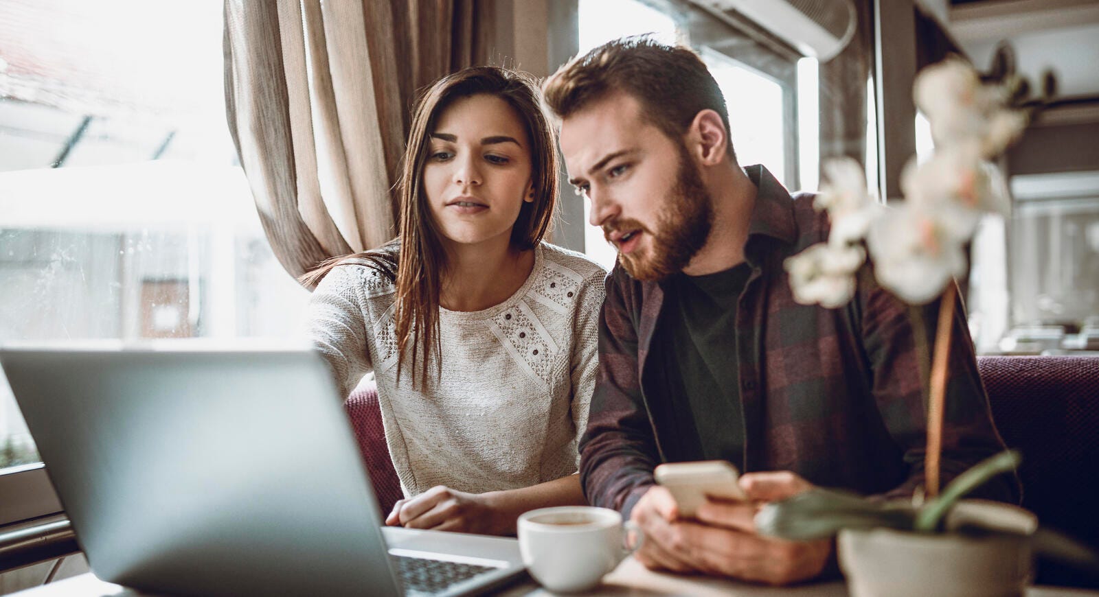 Couple looking at laptop