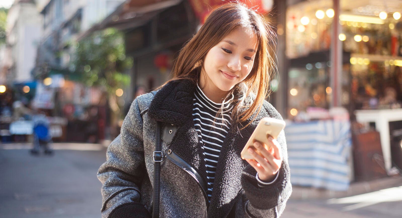 woman looking at her phone