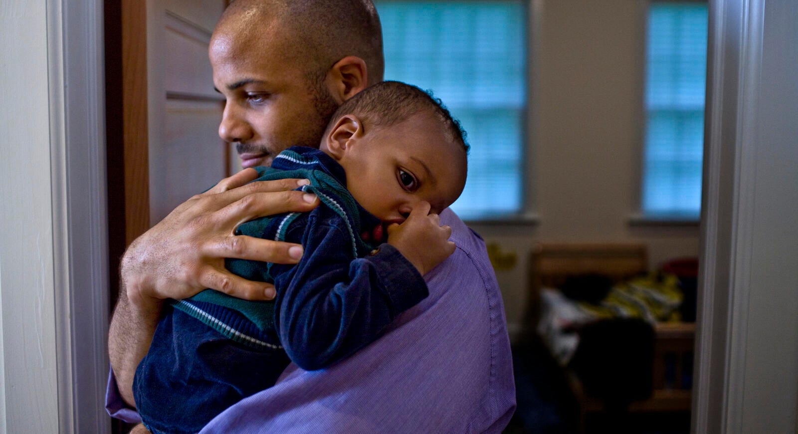 man holding a baby