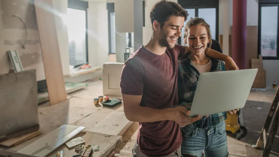Man and woman working on computer