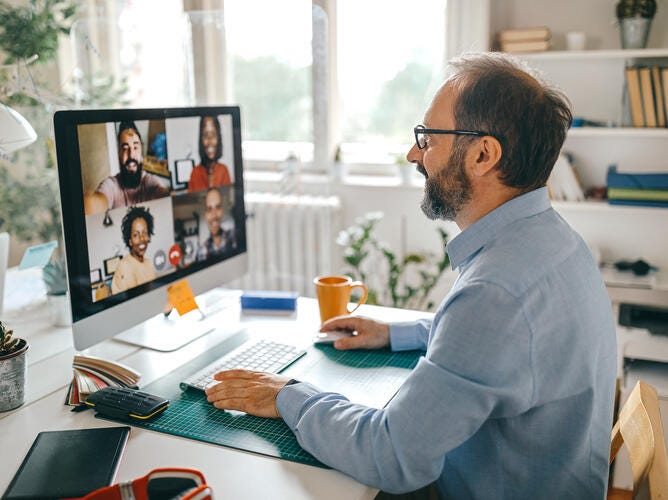 man working at desktop computer