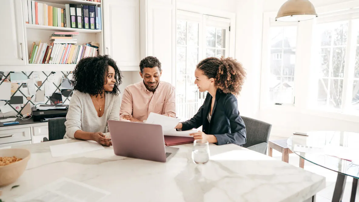A financial advisor meeting with a client to review investment and retirement planning options
