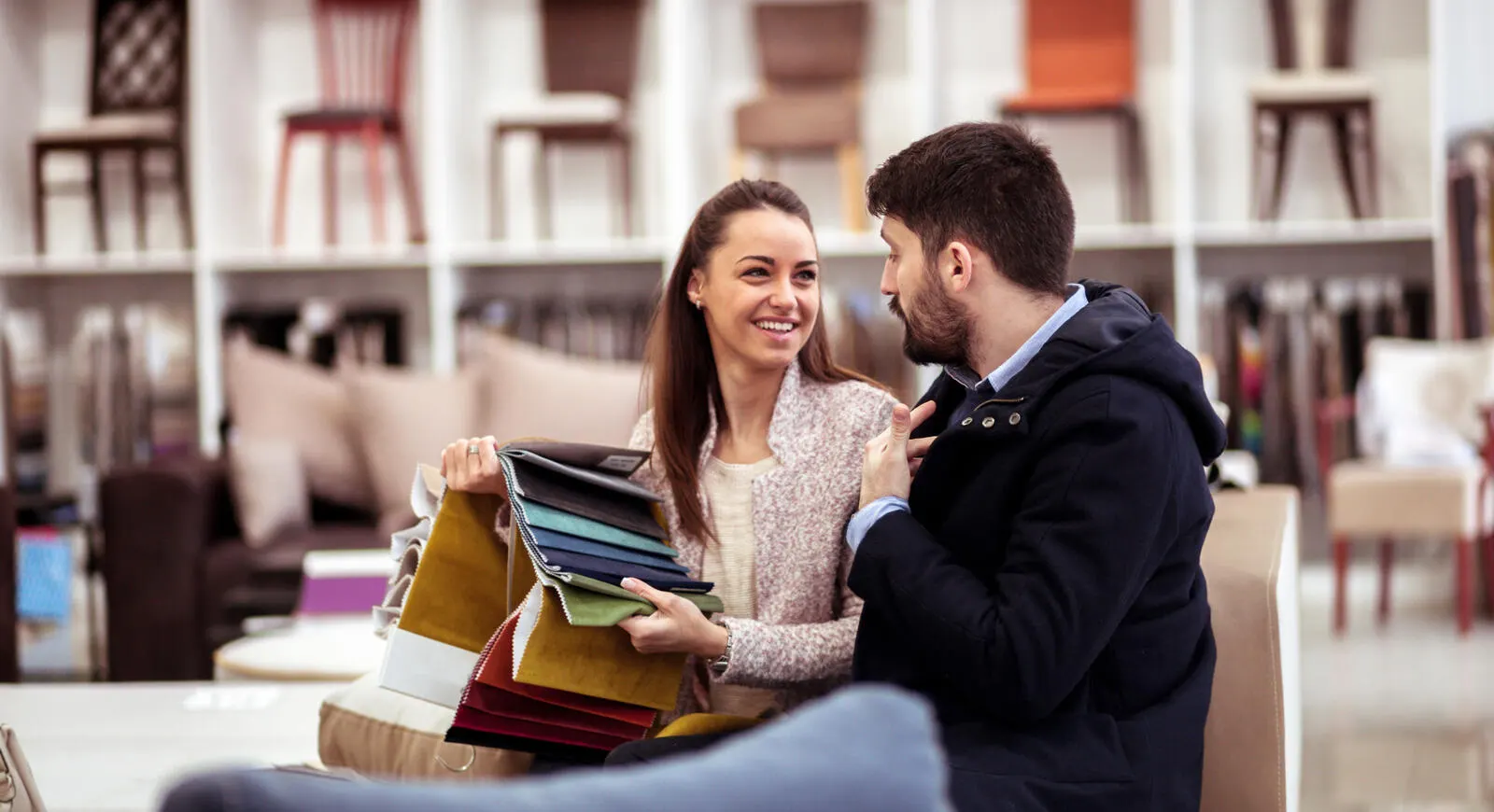 woman and man looking at fabric samples