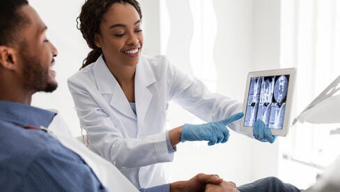 doctor holding x-ray