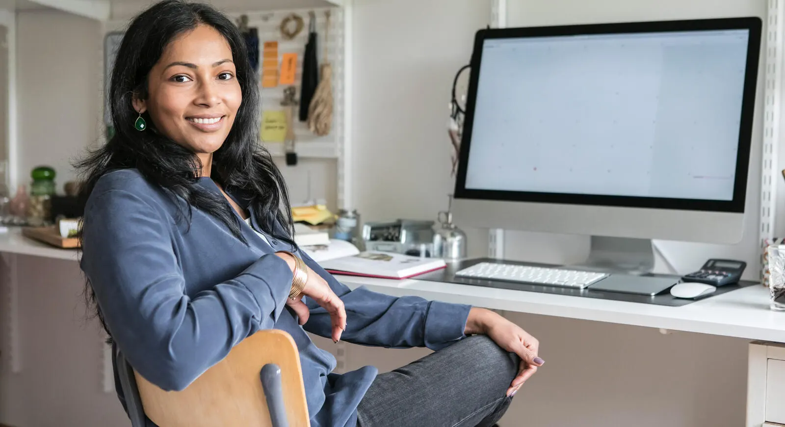 Woman sitting at desk in home office