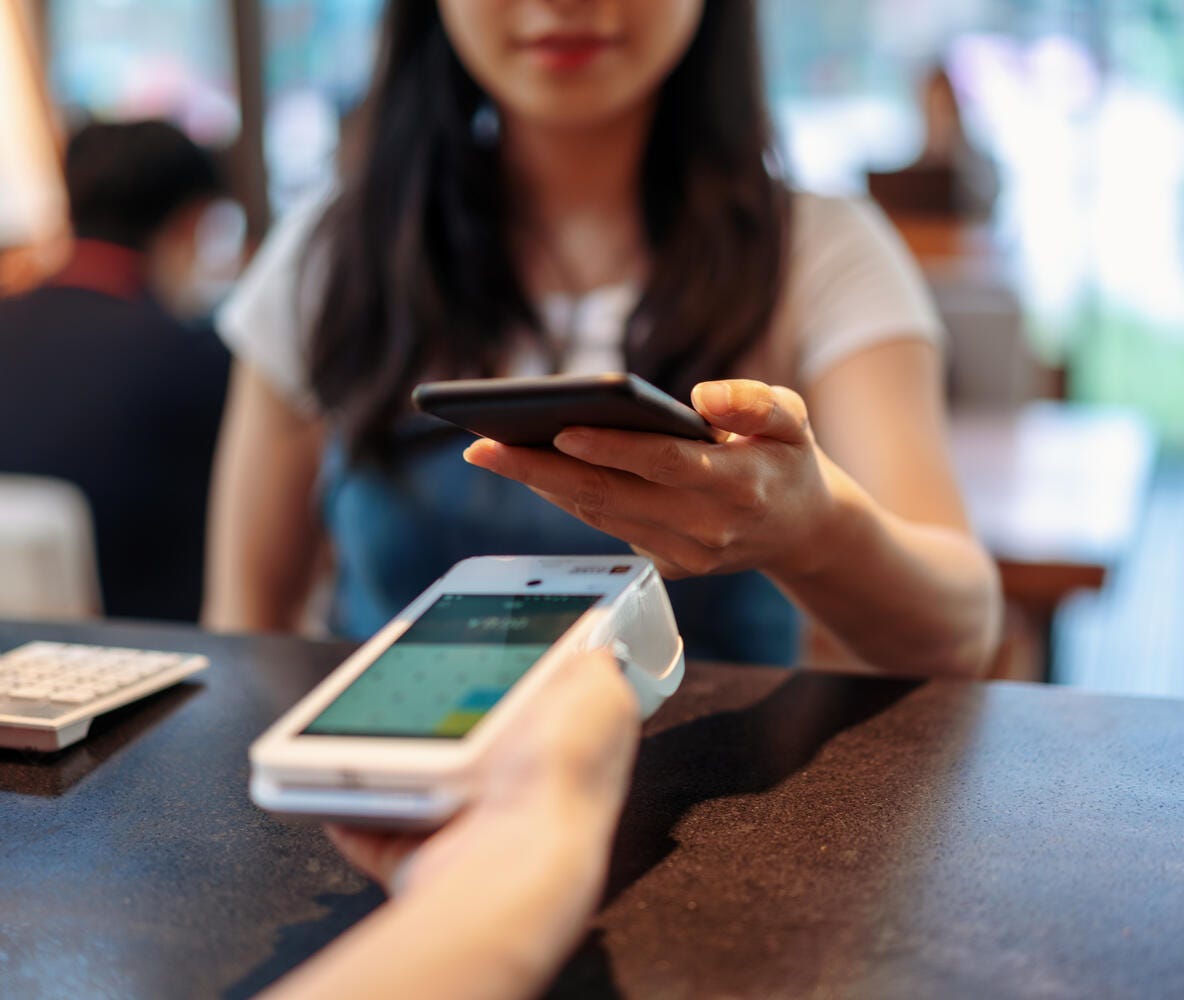 Woman paying with phone