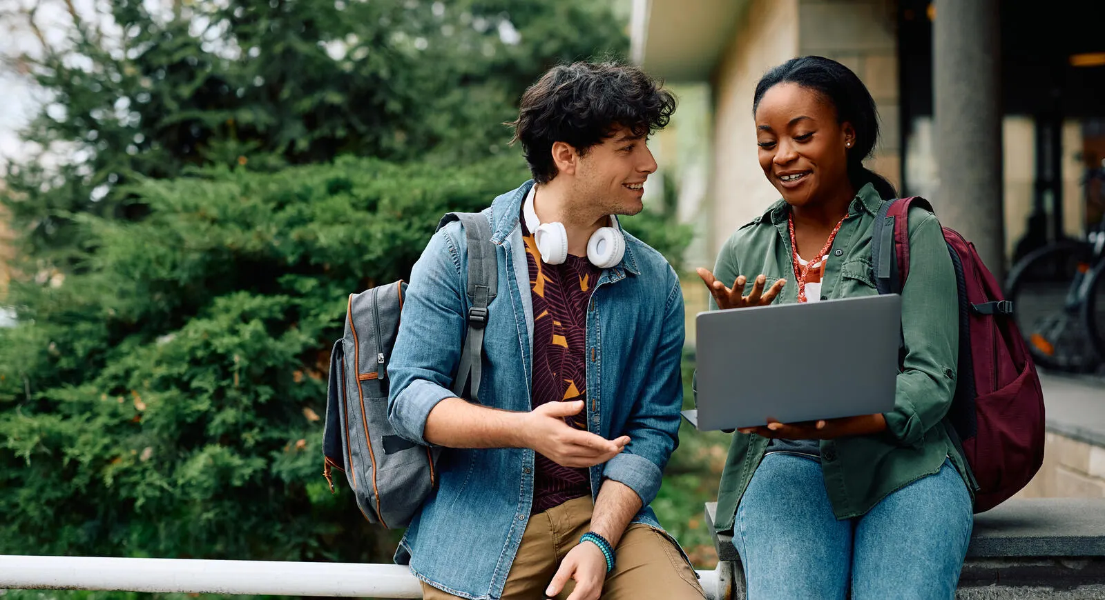 Two students looking up scholarship opportunities