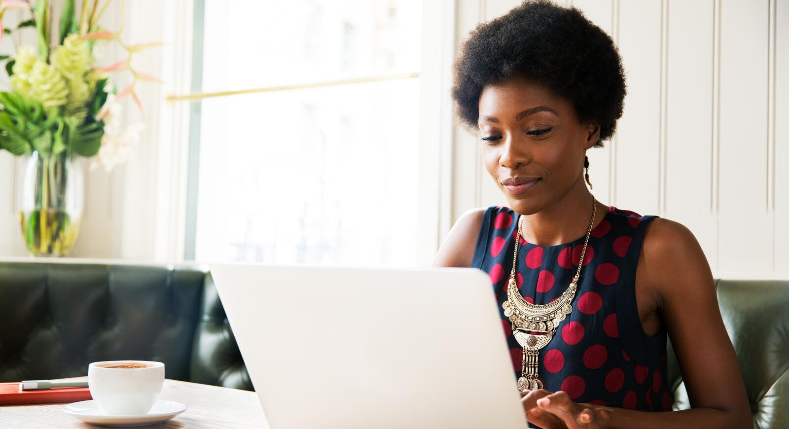 woman typing on a laptop 